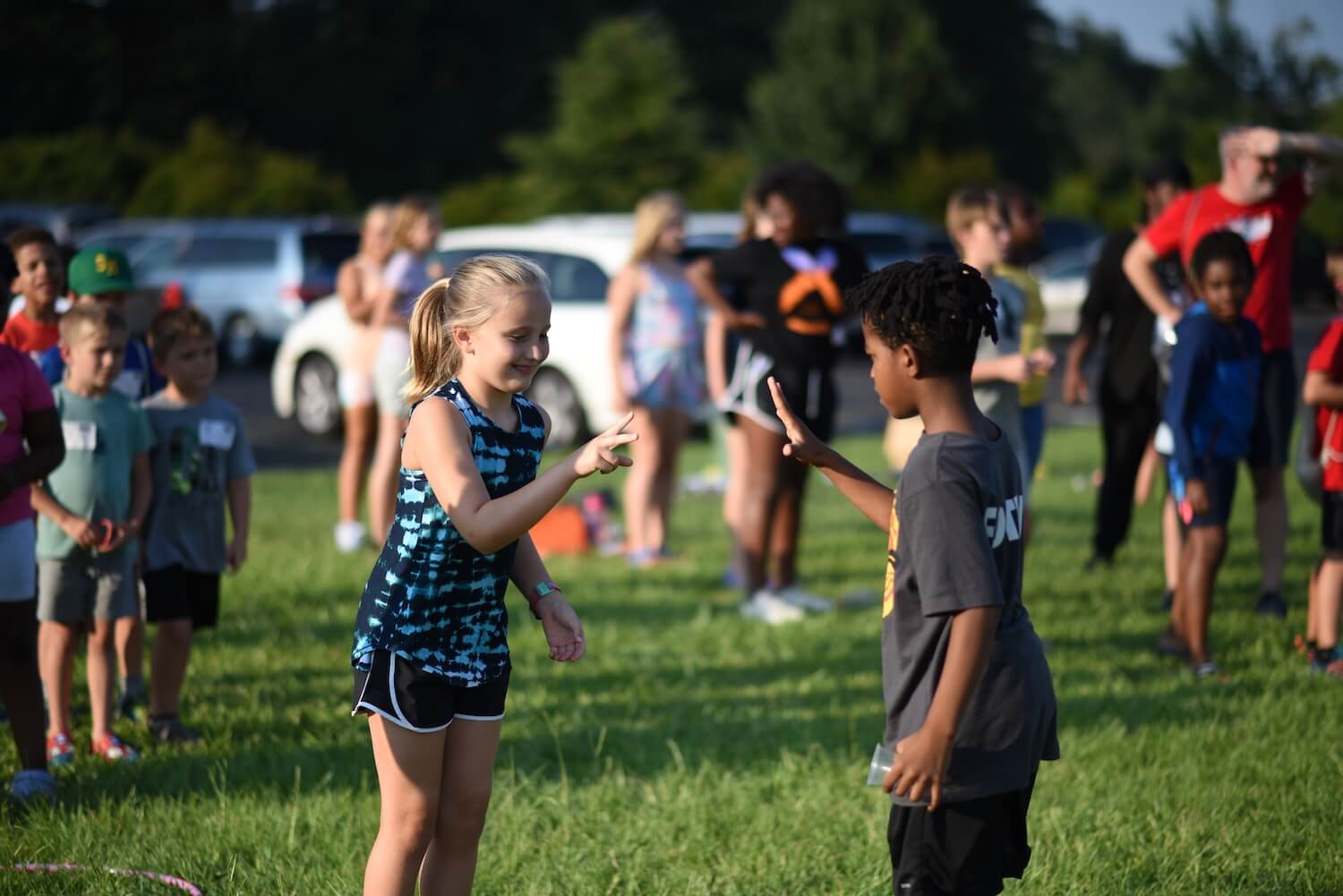 Two campers playing a game on the field