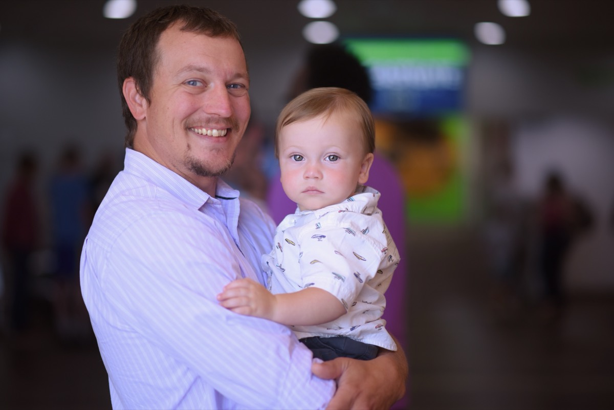 An Eastgate man holding his young son