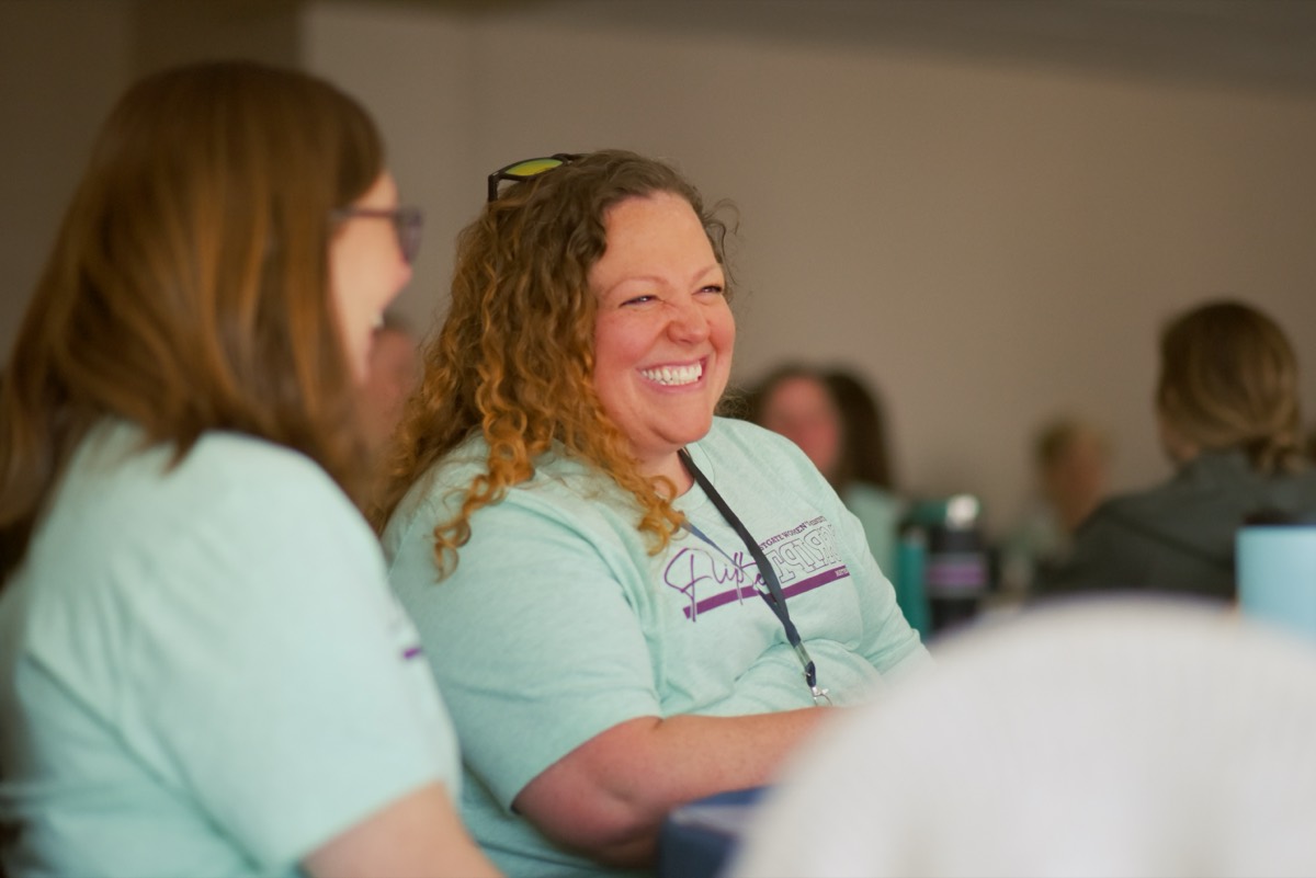 Eastgate women laughing together at a retreat